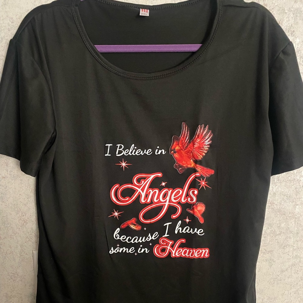 New women’s T-shirt w/ saying. I believe in angels because I have some in heaven